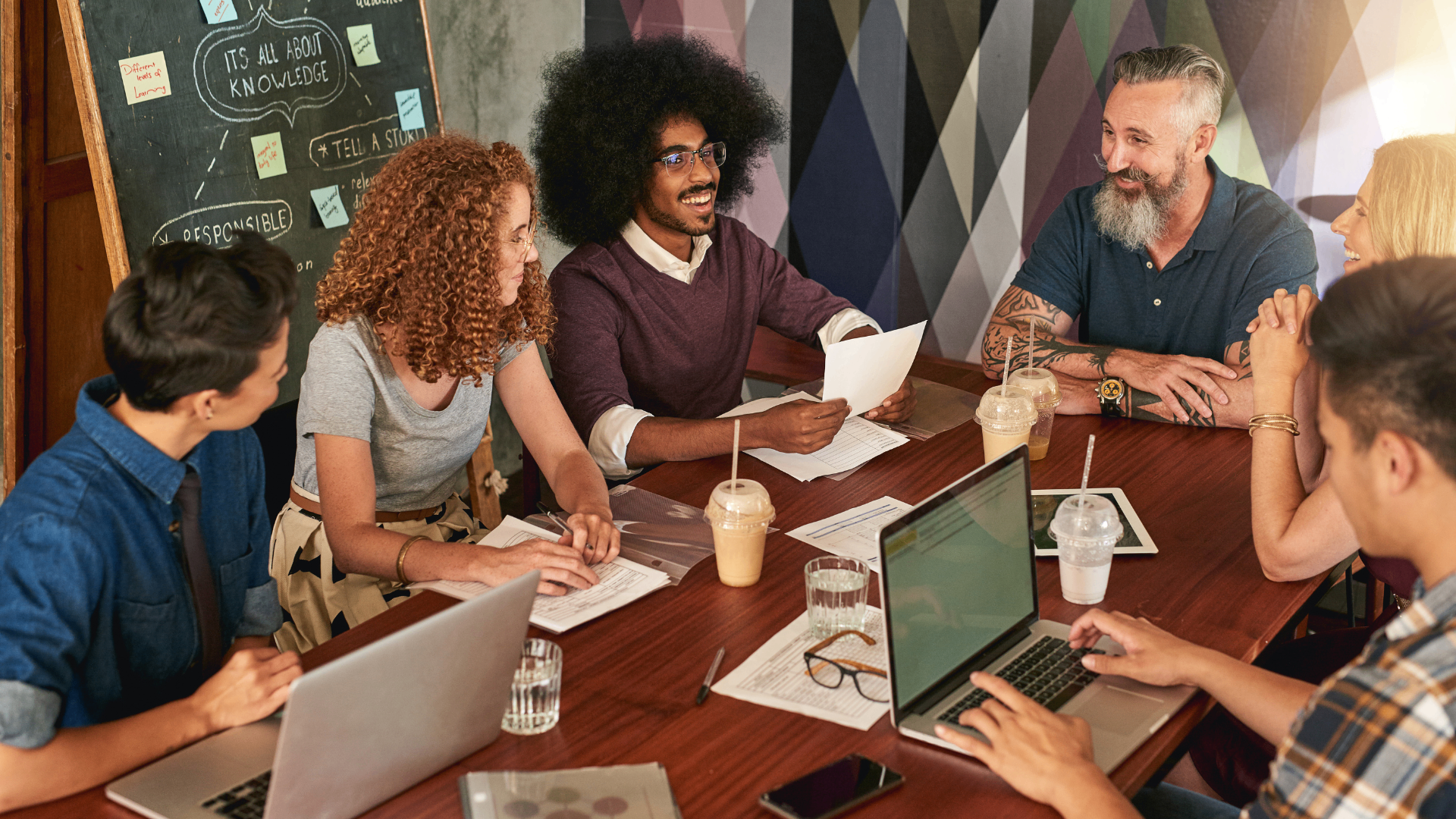 Diverse team collaborating around a meeting table